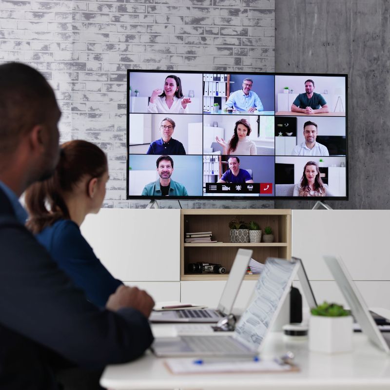 Office workers engaging in a video meeting