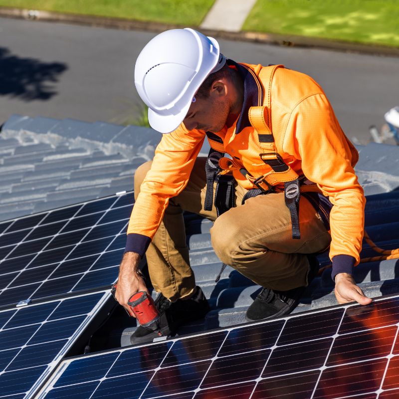 Technician installing solar panel