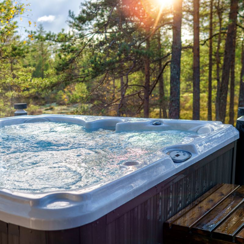 Hot tub with a pine forest in the background