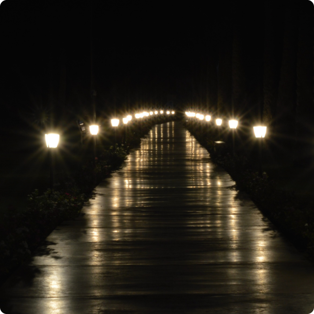 Front of the house illuminated by outdoor pathway lights