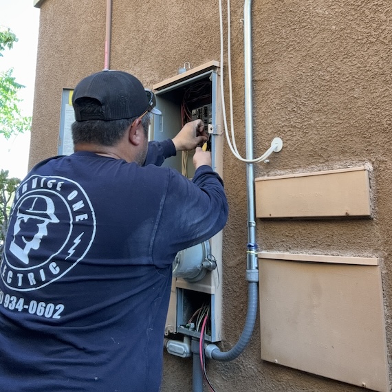 electrician working on an outdoor oven circuit corona electrician