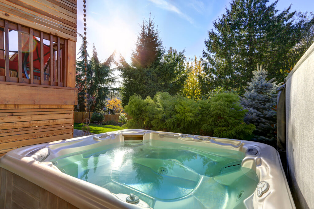 jacuzzi in a backyard in the forest