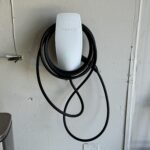 tesla ev charger installed in a residential garage